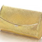 A 14K GOLD AND DIAMOND CLUTCH, VAN CLEEF & ARPELS