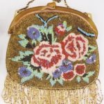 AN ENGLISH BEADED EVENING PURSE, in a multi-colored floral design